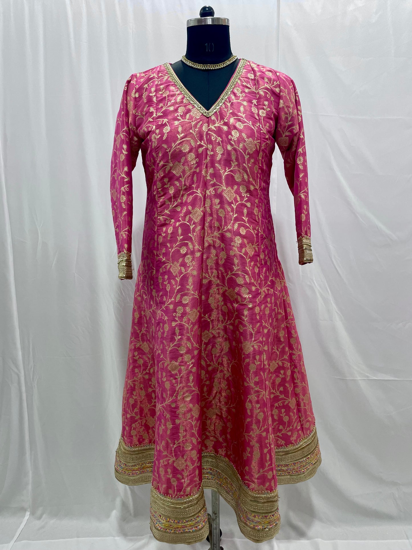 Pink anarkali salwar kameez suit designed with embroidered tissue fabric