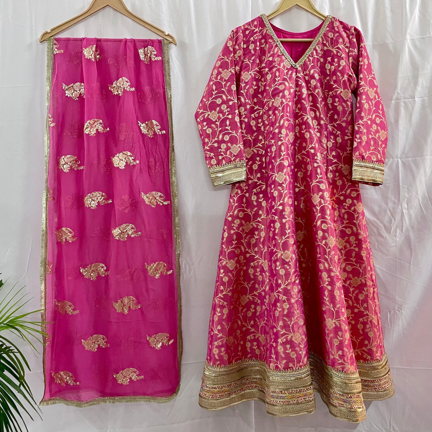 Pink anarkali salwar kameez suit designed with embroidered tissue fabric