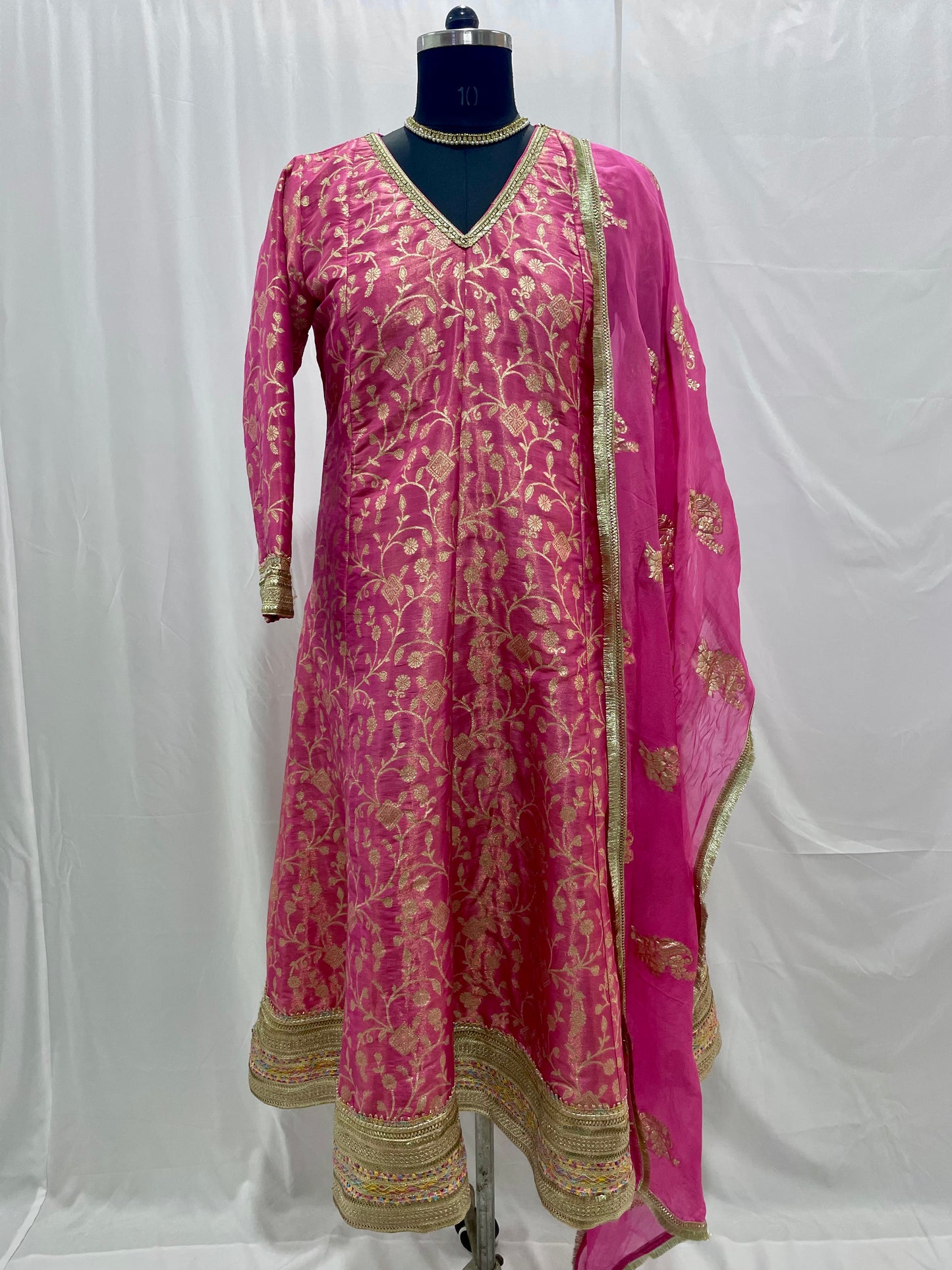 Pink anarkali salwar kameez suit designed with embroidered tissue fabric