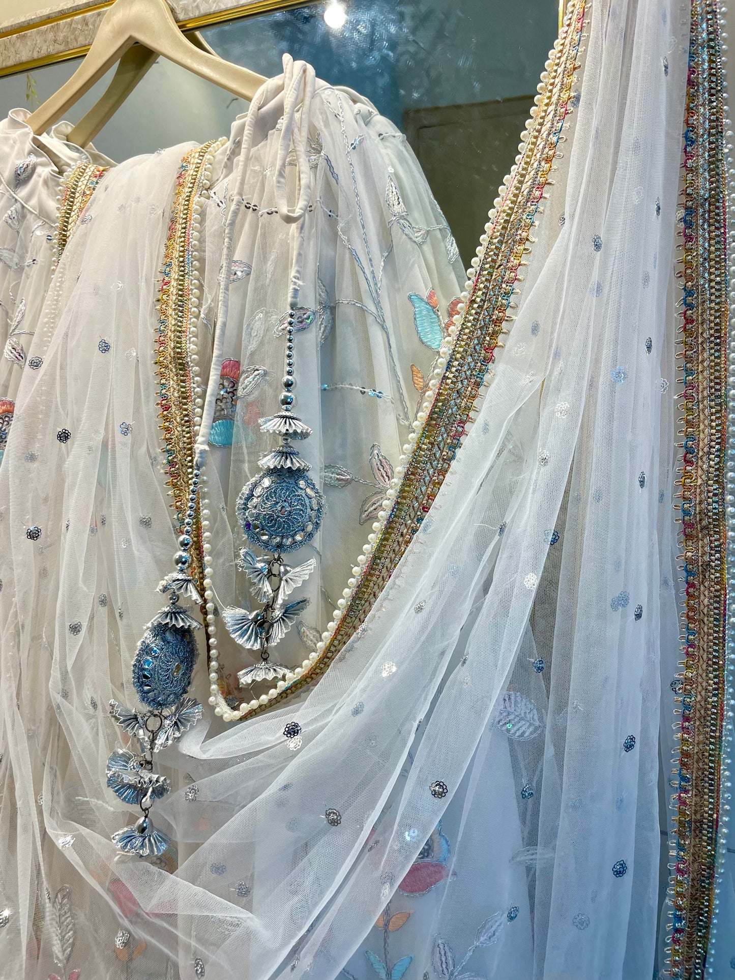 Elegant White Net Embroidered Lehenga Choli with Colorful Floral Detailing – Festive & Wedding Wear