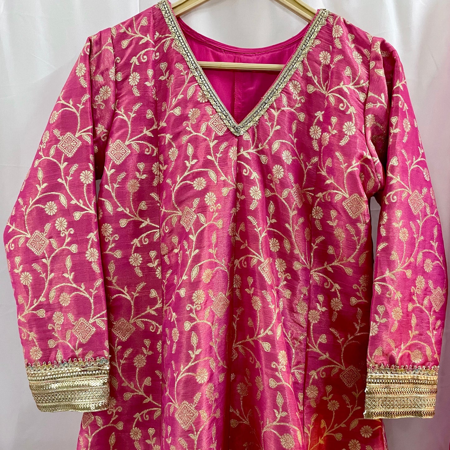 Pink anarkali salwar kameez suit designed with embroidered tissue fabric