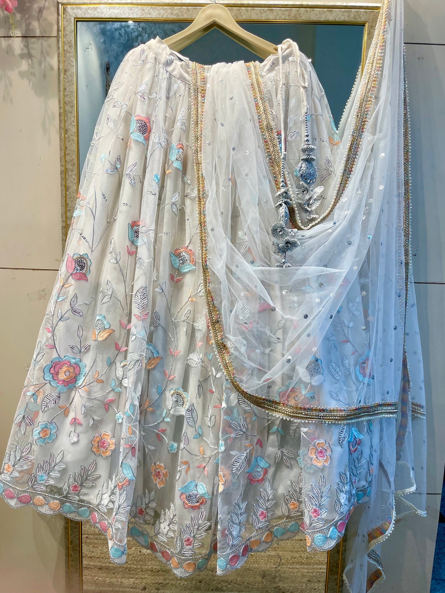Elegant White Net Embroidered Lehenga Choli with Colorful Floral Detailing – Festive & Wedding Wear