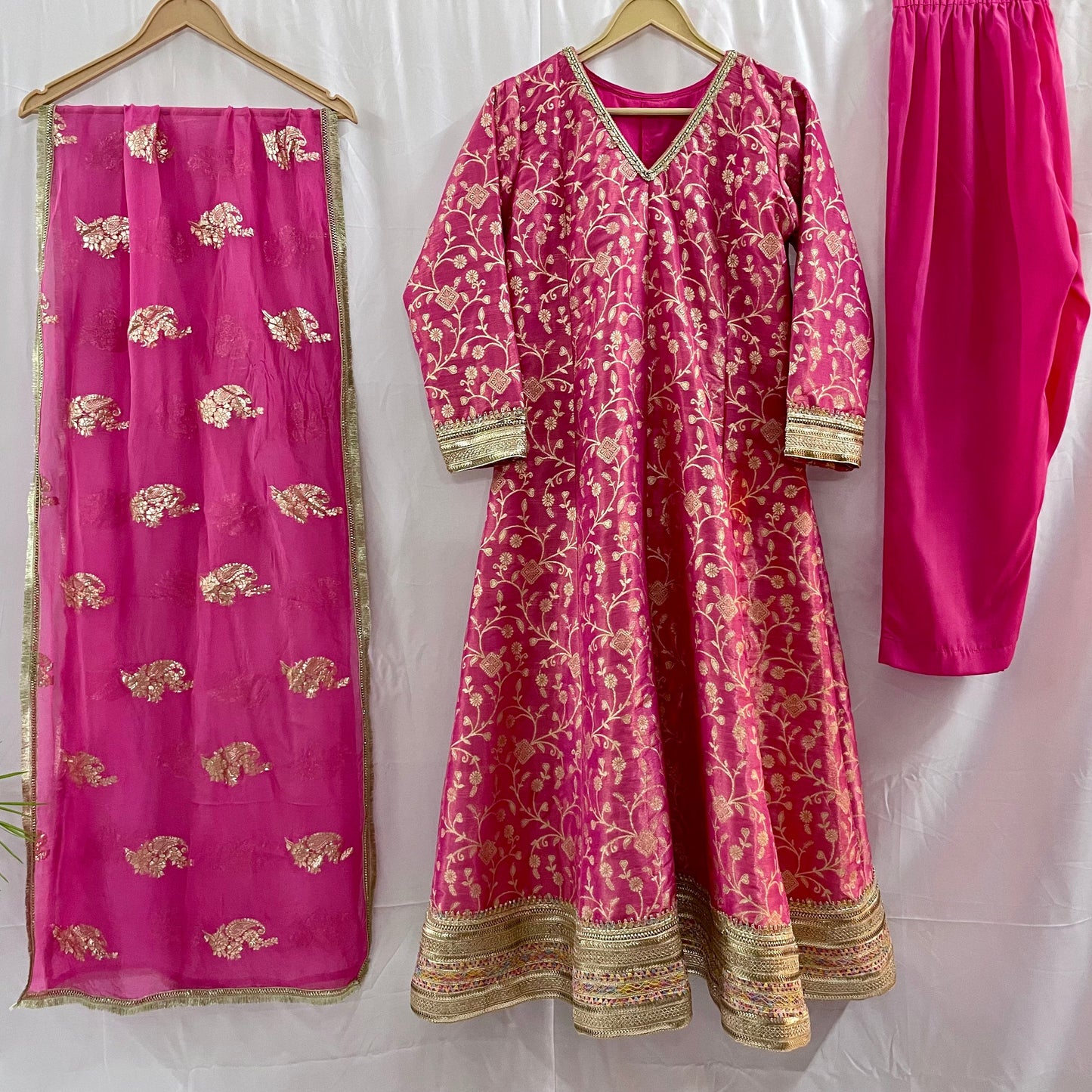 Pink anarkali salwar kameez suit designed with embroidered tissue fabric