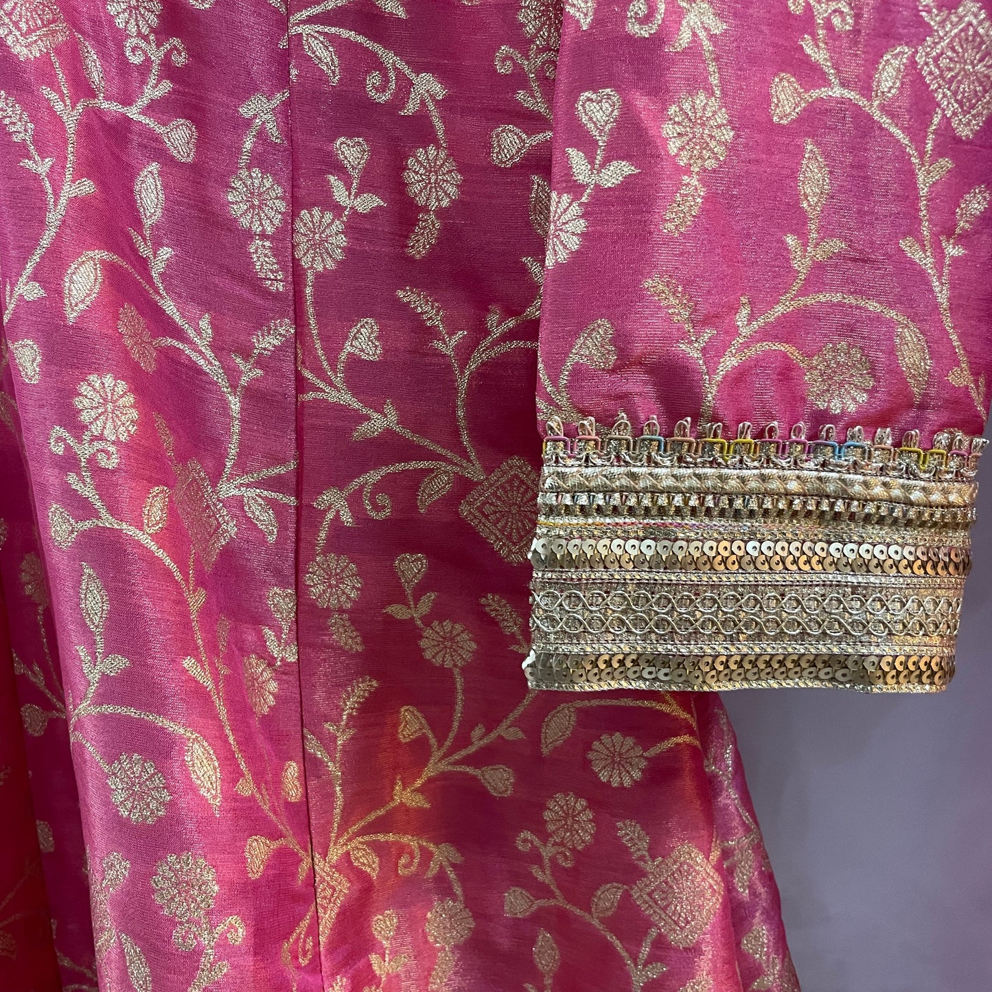 Pink anarkali salwar kameez suit designed with embroidered tissue fabric