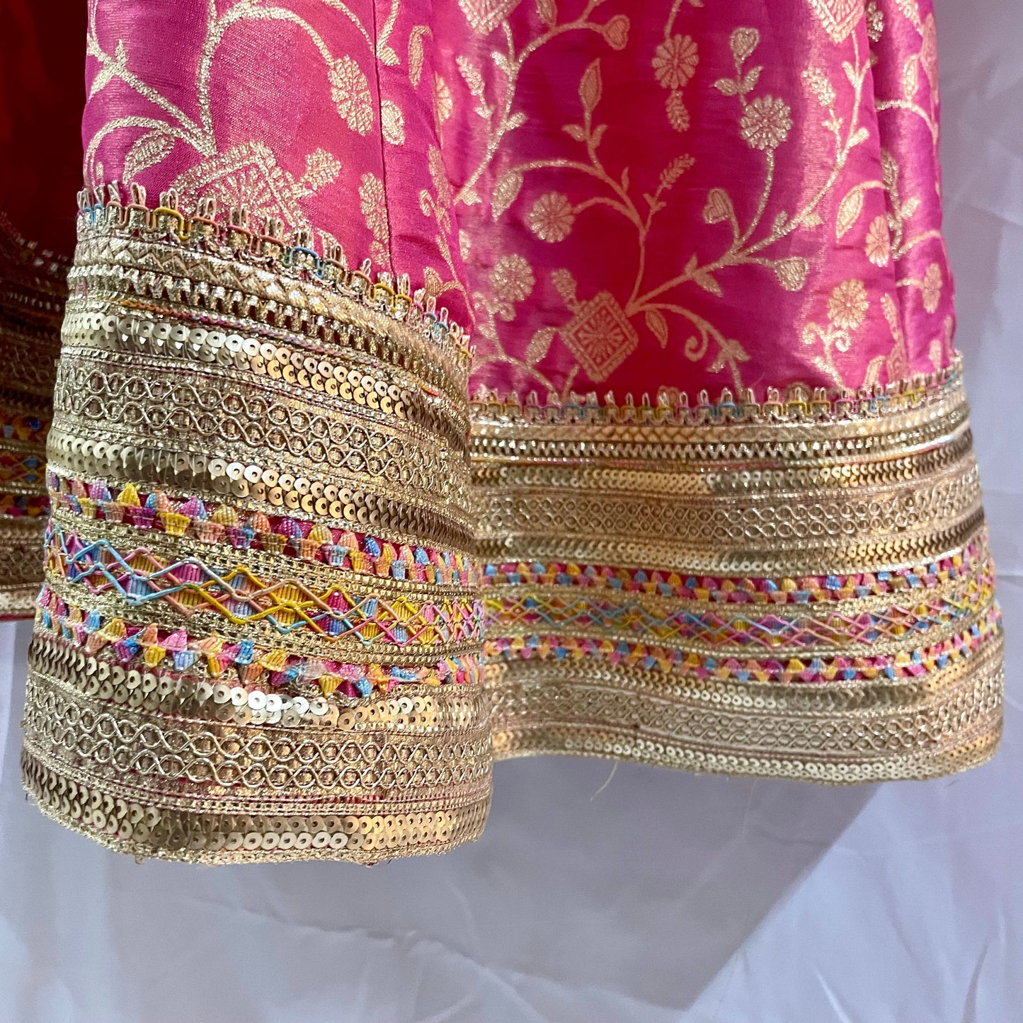 Pink anarkali salwar kameez suit designed with embroidered tissue fabric