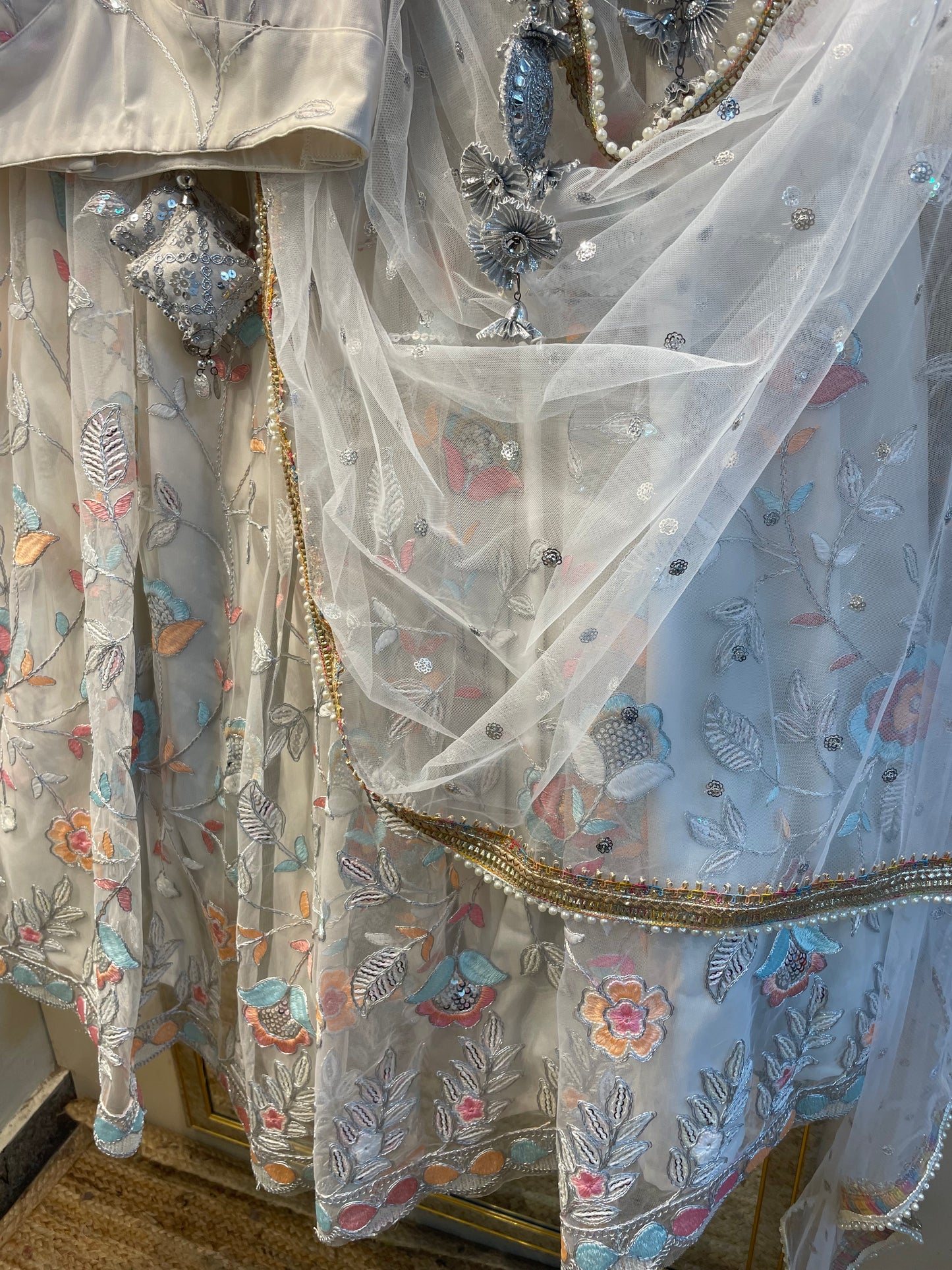 Elegant White Net Embroidered Lehenga Choli with Colorful Floral Detailing – Festive & Wedding Wear