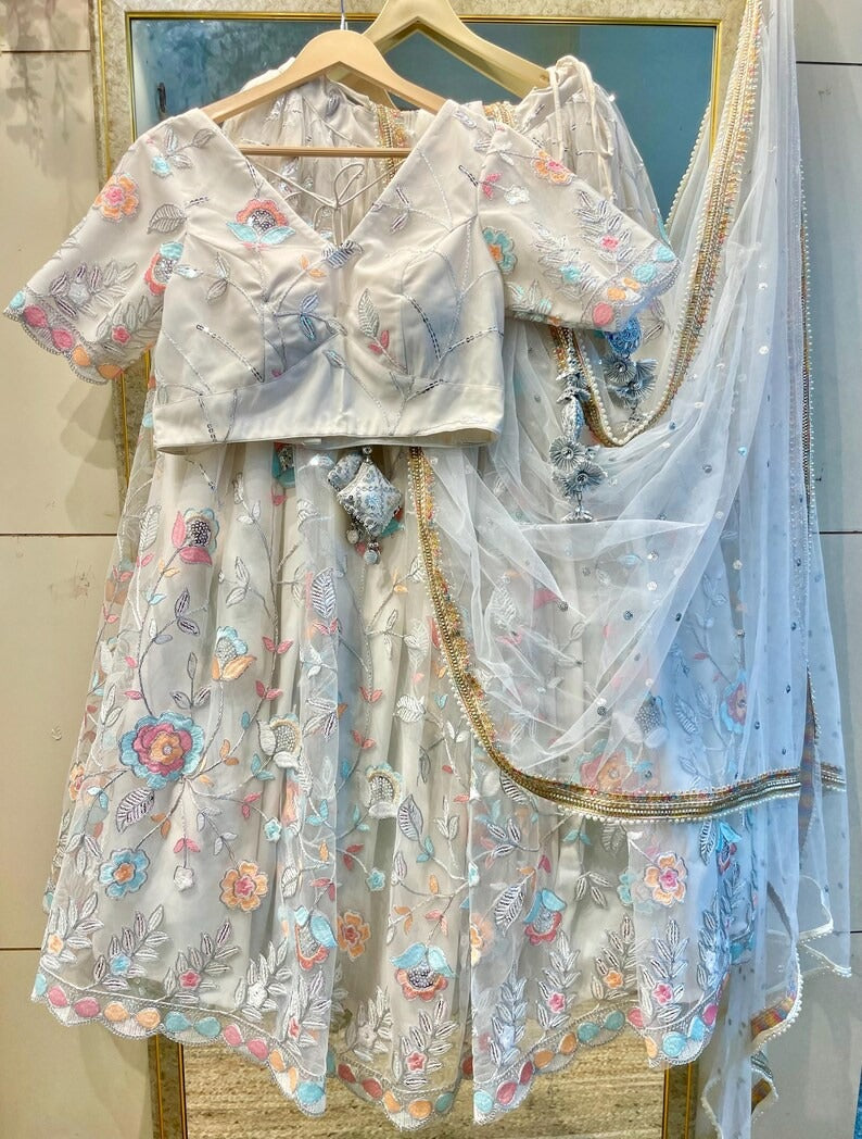 Elegant White Net Embroidered Lehenga Choli with Colorful Floral Detailing – Festive & Wedding Wear