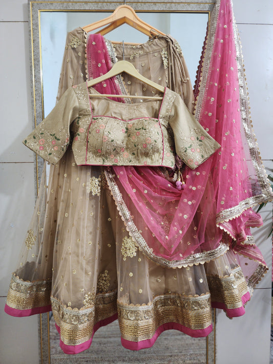 Indian designer golden lehenga with pink dupatta